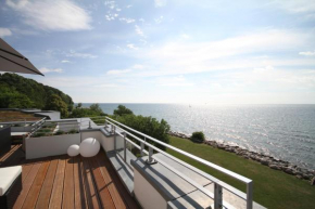 Гостиница Ostseeresidenz Sassnitz - WG 18 mit Kamin, Sauna, Terrasse, Meerblick  Зелин